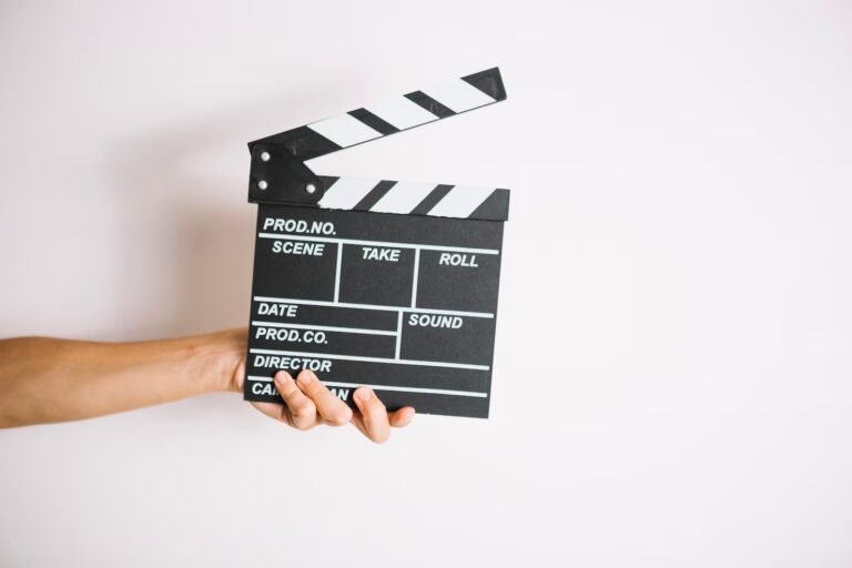crop-hand-holding-clapperboard_23-2147699831